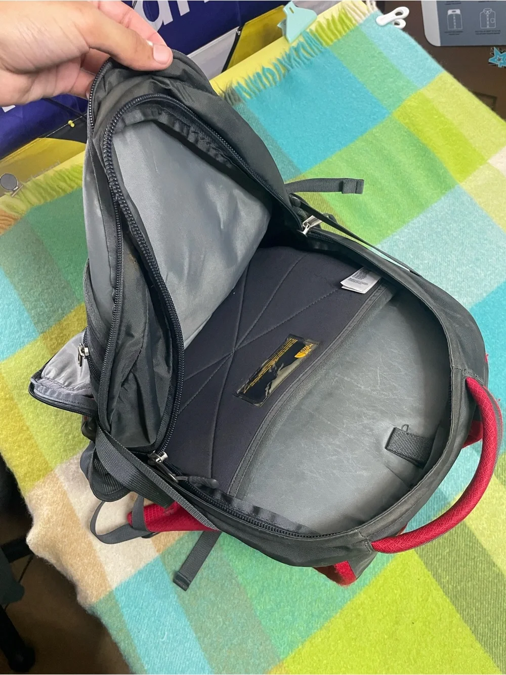 The North Face Recon backpack in charcoal gray and bright red